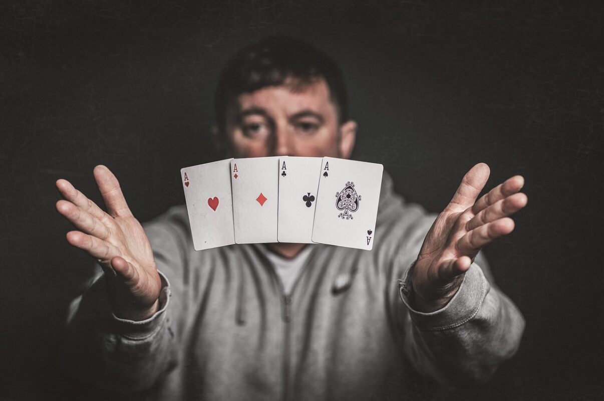 Two people playing a card game at a table